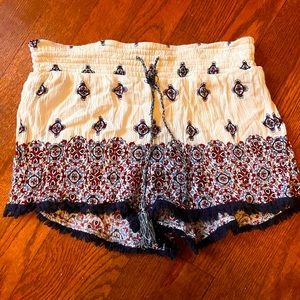 These are flowy shorts that are red blue and white